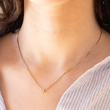 Collana vintage in oro 14K con punto luce di 0.10ct ca., anni ‘70/‘80
