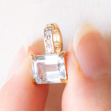 Ciondolo vintage in oro giallo e bianco 14K con topazio azzurro (2ct ca.) e diamanti (0.03ctw ca.), anni ‘70