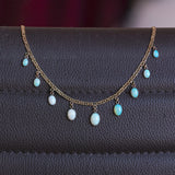 Collana vintage in oro 18K con opali di taglio cabochon, anni ‘70