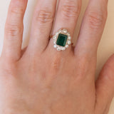 Bague marguerite en or 14 carats avec émeraude (environ 1,50 ct) et diamants (environ 0,80 ct), années 1940/1950