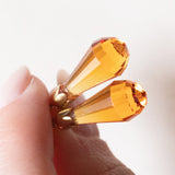 Orecchini vintage pendenti in oro giallo 18K con zaffiri arancioni, anni '70/'80