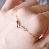 Collana vintage in oro 18K con rubini (0.25ctw ca.) e diamanti (0.25ctw ca.), anni ‘70