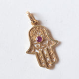 Ciondolo “Mano di Fatima” vintage in oro 18K con rubino, anni ‘70