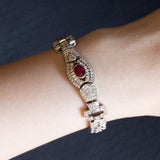 Bracciale semirigido vintage in oro bianco 18K con rubino naturale (0.90ct ca.) e diamanti (6.30ctw ca.), anni ‘60