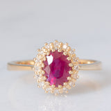Anello a margherita vintage in oro giallo 14K con rubino (1.50ct ca.) e diamanti (0.16ctw ca.), anni ‘70/‘80