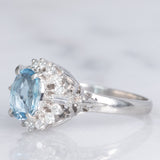 Anello a margherita vintage in platino con acquamarina (0.93ct) e diamanti (0.29ctw), anni ‘80