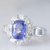 Anello a margherita vintage in platino con tanzanite (2.04ct) e diamanti di taglio brillante e baguette (1.35ctw), anni ‘90