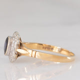 Anello a margherita vintage in oro giallo e bianco 9K con zaffiro (0.60ct ca.) e diamanti (0.12ctw ca.), anno 1991