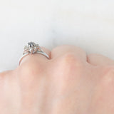 Anello a margherita vintage in platino con zaffiro (0.45ct ca.) e diamanti (0.14ctw ca.), anno 2006