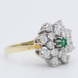 Anello a fiore/fiocco di neve in oro giallo e bianco 14K con smeraldo (0.13ct ca.) e diamanti di taglio brillante (1.24ctw ca.), anni ‘70