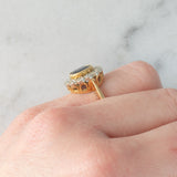 Anello a margherita vintage in oro 18K con zaffiro (1.10ct ca.) e diamanti di taglio brillante (0.50ctw ca.), anni ‘60