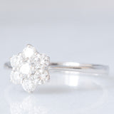 Anello a margherita vintage in oro bianco 14K con diamanti di taglio brillante (0.55ctw ca.), anni ‘80
