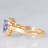 Anello a margherita vintage in oro giallo e bianco 9K con tanzanite (0.60ct ca.), anni ‘90