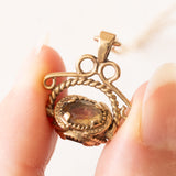 Vintage-Halskette mit drehbarem Anhänger aus 9-karätigem Gelbgold mit Quarz und Granat