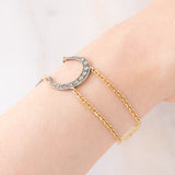 Vintage 18K yellow gold and silver semi-rigid bracelet with crescent-shaped decorations and rose-cut diamonds, 50s
