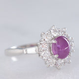 Anello a margherita vintage in platino con rubino stellato (1.35ct) e diamanti (0.66ctw ca.), anni ‘90