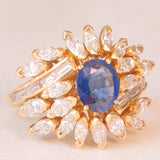 Vintage 18K yellow gold ring with sapphire (1.20ct approx.) and marquise and baguette cut diamonds (2.70ctw approx.), 70s