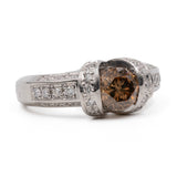 Anello vintage in platino 900 con diamante centrale brown di 1,01ct e contorno di diamanti bianchi (0,32ctw)