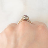 Anello a margherita vintage in oro bianco 14K con rubino (0.50ct ca.) e diamanti (0.30ctw ca.), anni ‘70/‘80