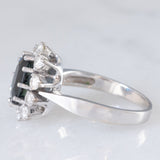 Gänseblümchenring aus 14 Karat Weißgold mit Saphir (ca. 1.50 ct) und Diamanten im Brillantschliff (ca. 0.60 ctw), 70er Jahre