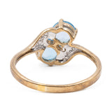 Anello vintage bypass in oro giallo 9K con topazi azzurri (0.90ctw ca.) e diamanti