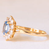 Vintage-Gänseblümchenring aus 18-karätigem Gelbgold mit blauem Topas (ca. 0.80 ct) und Diamanten im Brillantschliff (ca. 0.50 ctw), 70er Jahre