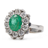 Bague marguerite vintage en or blanc 14 carats avec émeraude (1,30 ct) et diamants (0,90 ct), années 60