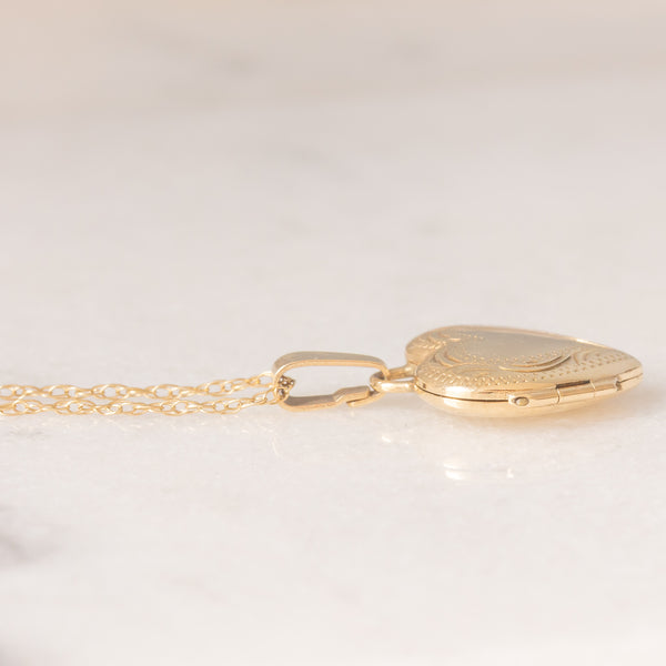 Collana vintage con catenina in oro giallo 9K e con ciondolo portafoto a forma di cuore in oro giallo 9K