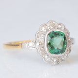 Anello a margherita antico in oro giallo 18K con tormalina verde (1ct ca.) e diamanti di taglio vecchia miniera (0.50ctw ca.), anni ‘20/‘30