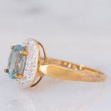 Anello a margherita in oro giallo 9K con zircone azzurro (1.83ct ca.) e zirconi bianchi