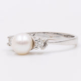 Vintage Ring aus 14 Karat Weißgold mit Perle und Diamanten (0.08 Karat), 60er Jahre