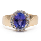 Vintage Gänseblümchenring aus 14-karätigem Gelbgold mit Tansanit (2.70 ct) und Diamanten (0.40 ctw)
