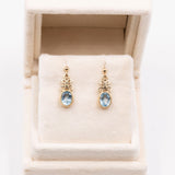 Orecchini vintage in oro giallo 9k con topazi azzurri