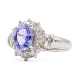 ANELLO A MARGHERITA VINTAGE IN PLATINO CON TANZANITE (1CT) E DIAMANTI (0.50CTW)