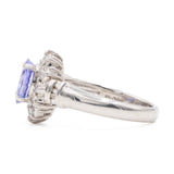 ANELLO A MARGHERITA VINTAGE IN PLATINO CON TANZANITE (1CT) E DIAMANTI (0.50CTW)