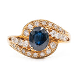 ANELLO TOURBILLON VINTAGE IN ORO GIALLO 14K CON ZAFFIRO (1.20CT CA.) E DIAMANTI (0.29CTW CA.), ANNI ‘80