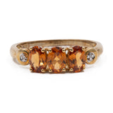 Anello trilogy in oro giallo 9k con granati arancioni (1,12ctw) e diamanti