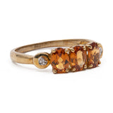 Anello trilogy in oro giallo 9k con granati arancioni (1,12ctw) e diamanti