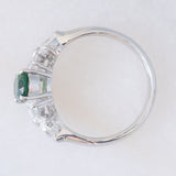Anello vintage in platino con tsavorite (0.94ct) e due fiori di diamanti (0.78ctw), anni ‘90/anni ‘2000