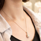 Collana vintage in platino con ciondolo con opale (1.78ct) e diamanti (0.56ctw)