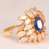 Vintage 18K yellow gold ring with sapphire (1.20ct approx.) and marquise and baguette cut diamonds (2.70ctw approx.), 70s