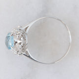 Anello a margherita vintage in platino con acquamarina (1.09ct) e diamanti (0.10ctw), anni ‘80/‘90