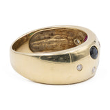 Bague vintage en or jaune 14 carats avec saphir, rubis, émeraude et diamants. Années 70