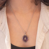 Necklace with 14K white gold chain and silver pendant with Chinese hibiscus insert and amethyst (approx. 14ct) and white beads