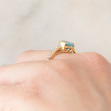 Anello in oro giallo 9K con zircone azzurro (1.63ct) e zirconi bianchi