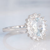 Anello a margherita in oro bianco 9K con acquamarina (1ct ca.) e diamanti di taglio brillante (0.16ctw ca.), anno 2006