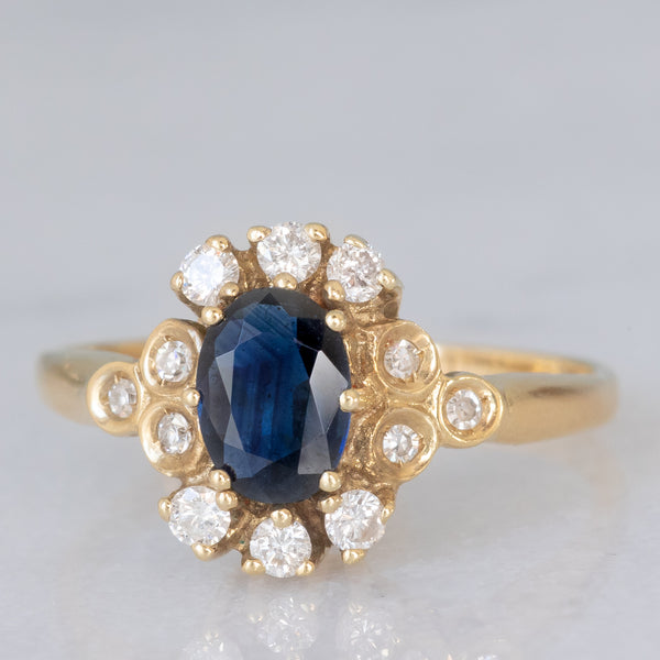 Anello a margherita vintage in oro giallo 14K con zaffiro (0.70ct ca.) e diamanti (0.20ctw ca.), anni ‘80