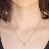 Collier vintage in platino con ciondolo a margherita con smeraldo (0.35ct) e diamanti (0.23ctw)