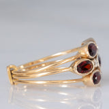 Anello harem in oro giallo 18K con granati (1.50ctw ca.) e pietre bianche, anni ‘60/‘70