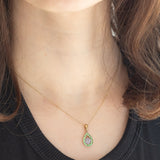 Coppia di ciondoli vintage in oro giallo 9K con tanzaniti e diamante e in oro giallo 8K con tanzaniti e peridoti